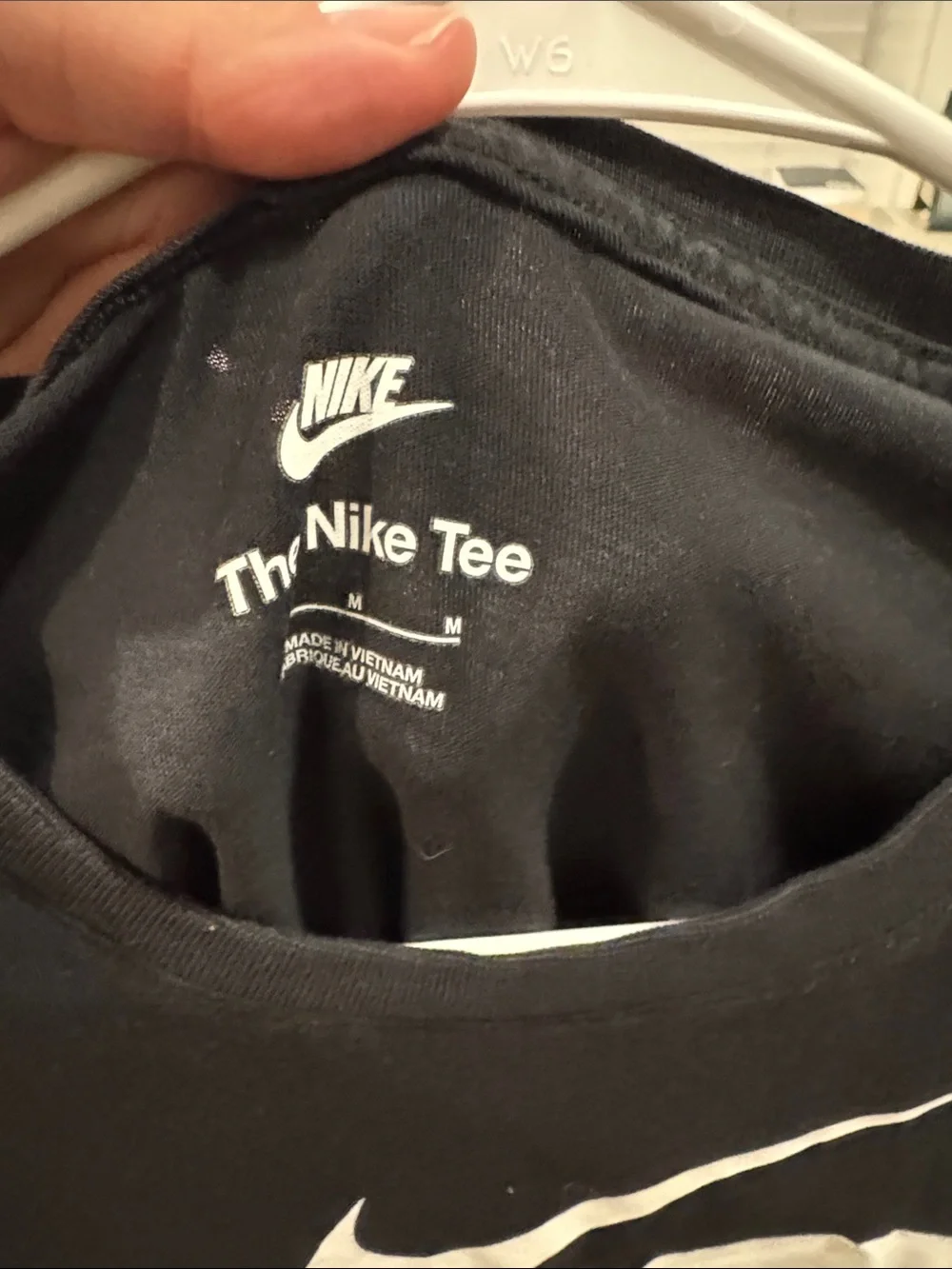 Nike Black Short-Sleeve Tee with White Swoosh Graphics